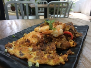 Close-up of freshly-cooked oyster omelette on a plate