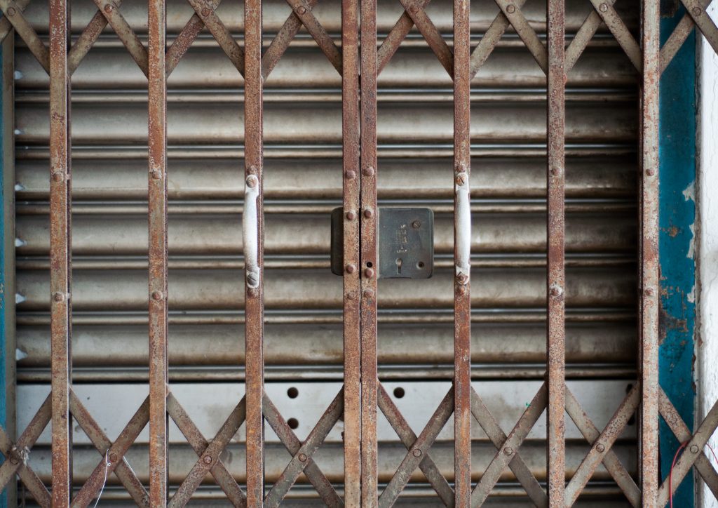Colour photo of a set of rusted iron shutters