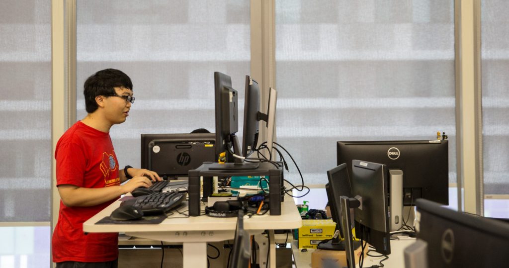 Photo of Zui Young working at this standing desk