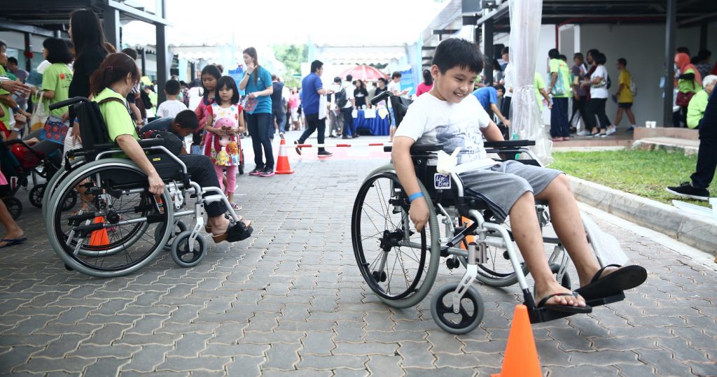 Photo of children at a wheelchair obstacle course