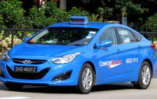 Photo of Comfort Delgro taxi on a Singapore road
