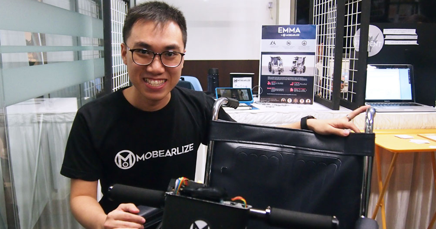 Photo of Mobearlize founder Chua Rui De posing with one of his mobility aids