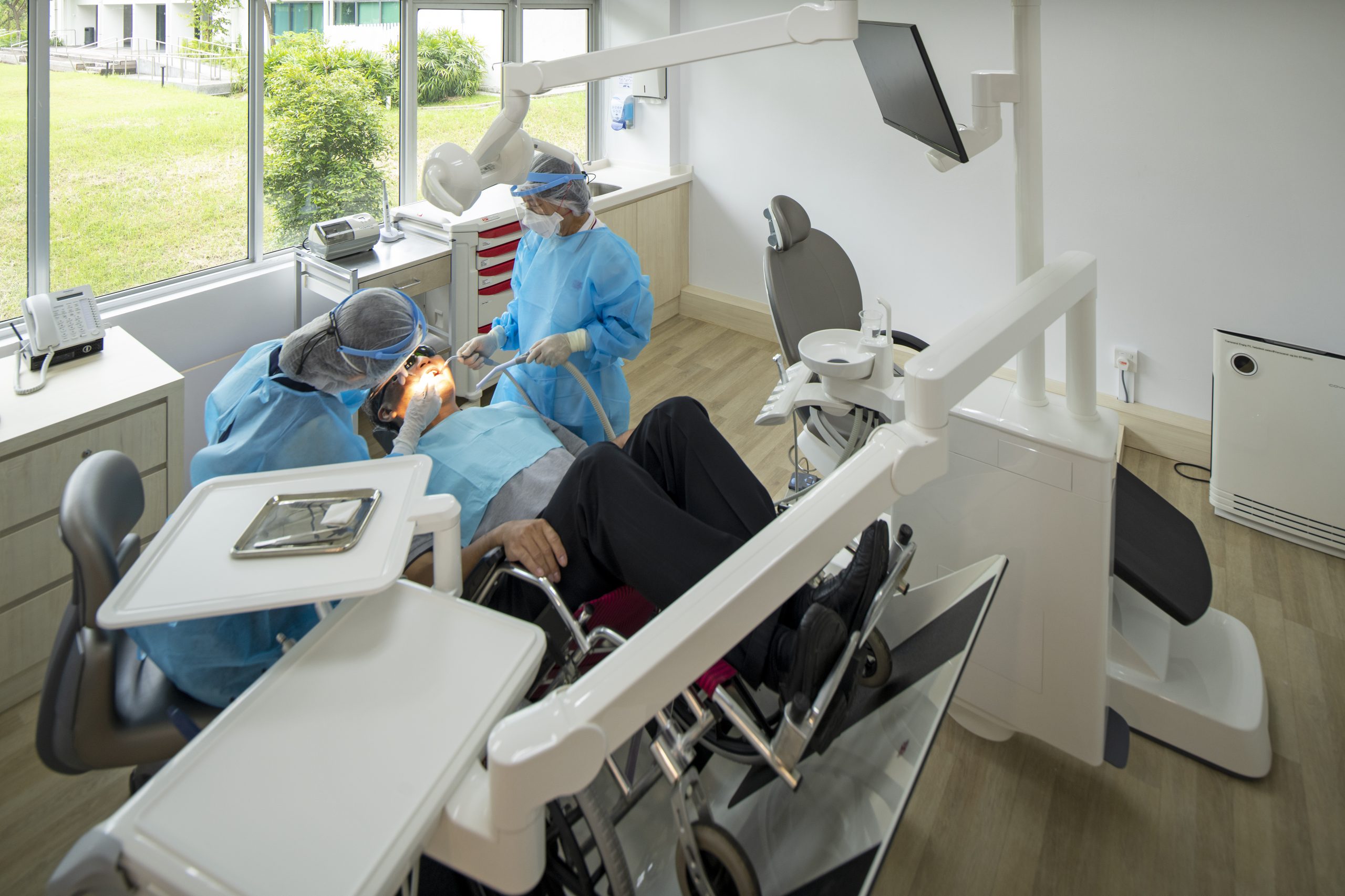 A wheelchair tilter is installed for wheelchair users when they undergo dental procedures